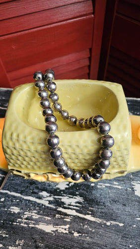 Vintage Navajo Beads strung on a wire 21